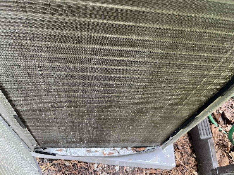 Completed comprehensive BFMA tune-up on 4+ year old air conditioning system as first stop of the day per client's schedule requirements. Performed full system inspection, documenting existing air filter condition showing moderate dust accumulation and debris buildup on pleated media. Inspected outdoor condenser unit, noting significant dirt and debris accumulation on heat exchanger coil fins and aluminum fin surfaces, with uniform environmental contamination present across coil face. Verified condensate pan condition and confirmed structural integrity of coil fins despite heavy surface soiling. System operational upon completion of tune-up service.
