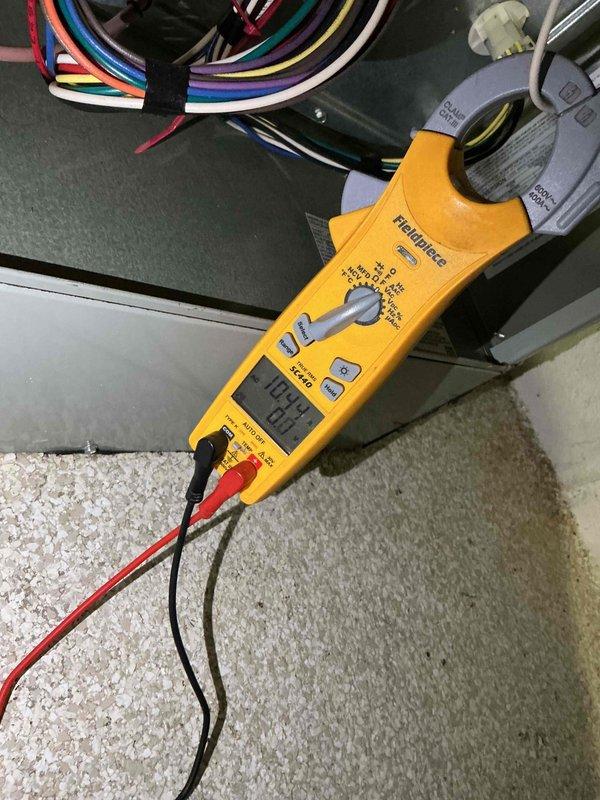 Completed comprehensive BFMA tune-up on 21+ year old air conditioning system as scheduled first stop appointment. Performed electrical diagnostics using clamp meter to measure current draw and voltage on outdoor condensing unit components, verifying proper amperage readings and system performance. Inspected capacitor, electrical connections, and wiring integrity, documenting equipment condition with diagnostic measurements to ensure safe and efficient operation of aging HVAC system.