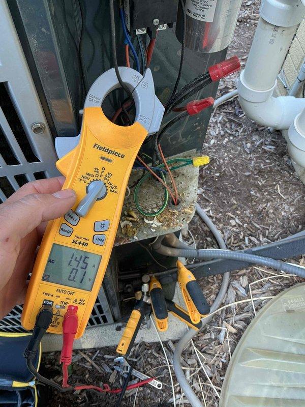 Completed comprehensive BFMA tune-up on 21+ year old air conditioning system as scheduled first stop appointment. Performed electrical diagnostics using clamp meter to measure current draw and voltage on outdoor condensing unit components, verifying proper amperage readings and system performance. Inspected capacitor, electrical connections, and wiring integrity, documenting equipment condition with diagnostic measurements to ensure safe and efficient operation of aging HVAC system.
