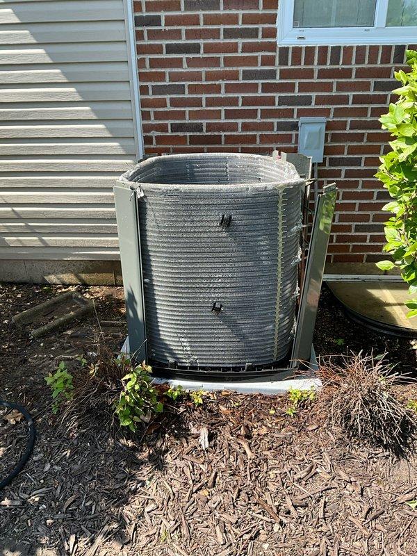 Completed comprehensive air conditioning tune-up on residential Trane condenser unit aged 2+ years. Performed standard maintenance protocol including inspection of all major components, cleaning of condenser coils, verification of refrigerant levels, testing of electrical connections, and confirmation of proper system operation. Unit is functioning within manufacturer specifications and positioned appropriately on concrete pad with adequate clearance from landscaping for optimal airflow and efficiency.