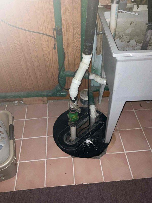 Completed comprehensive BFMA tune-up service on residential air conditioning system over 4 years old. Performed standard maintenance protocol including inspection of outdoor condenser unit with circular finned coil assembly, verified proper operation of all components, and assessed indoor equipment located in basement utility area. System evaluated and found operating within normal parameters following tune-up procedures.