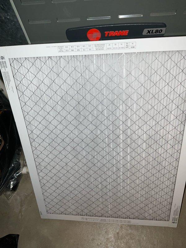 Completed BFMA tune-up service on a 9-year-old Trane XL80 furnace and associated outdoor air conditioning unit. Performed comprehensive system inspection, replaced air filter, verified proper airflow through pleated media filter, and inspected outdoor condenser unit with decorative fence enclosure. All components operating within normal parameters with no deficiencies noted at time of service.