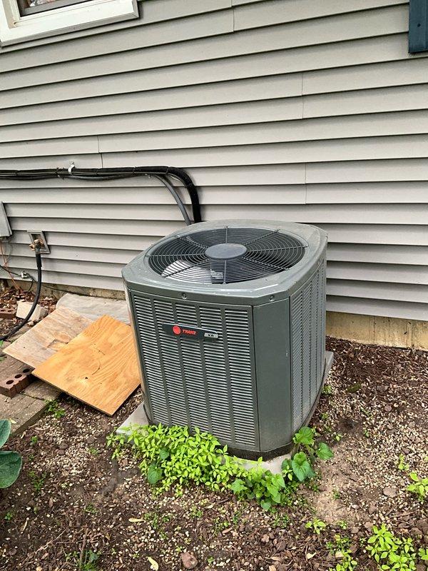 Completed comprehensive BFMA tune-up service on Trane air conditioning system with approximately 10 years of operation. Performed standard preventive maintenance protocol including inspection of condenser unit, verification of electrical connections and conduit integrity, assessment of refrigerant lines, and evaluation of overall system operation. Unit exterior and surrounding area inspected, with equipment found to be properly positioned on concrete pad and operational; coordinated arrival time and communication preferences with property occupant prior to service visit.