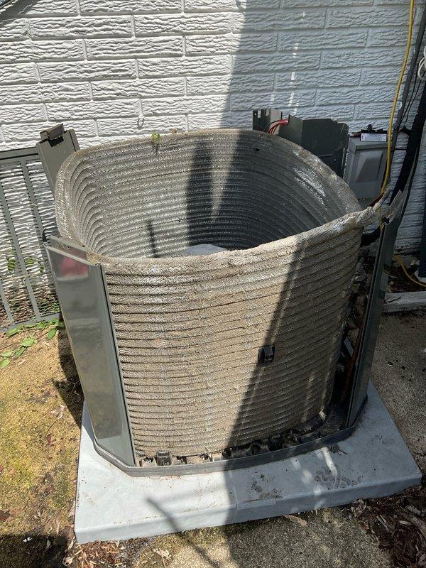 Completed comprehensive BFMA air conditioning tune-up on 2-year-old Trane condenser unit. Removed exterior panels to access condenser coil, which exhibited heavy accumulation of dirt, dust, and debris throughout the fin structure. Performed thorough coil cleaning to restore proper airflow and heat transfer efficiency, reassembled unit, and verified operational performance.
