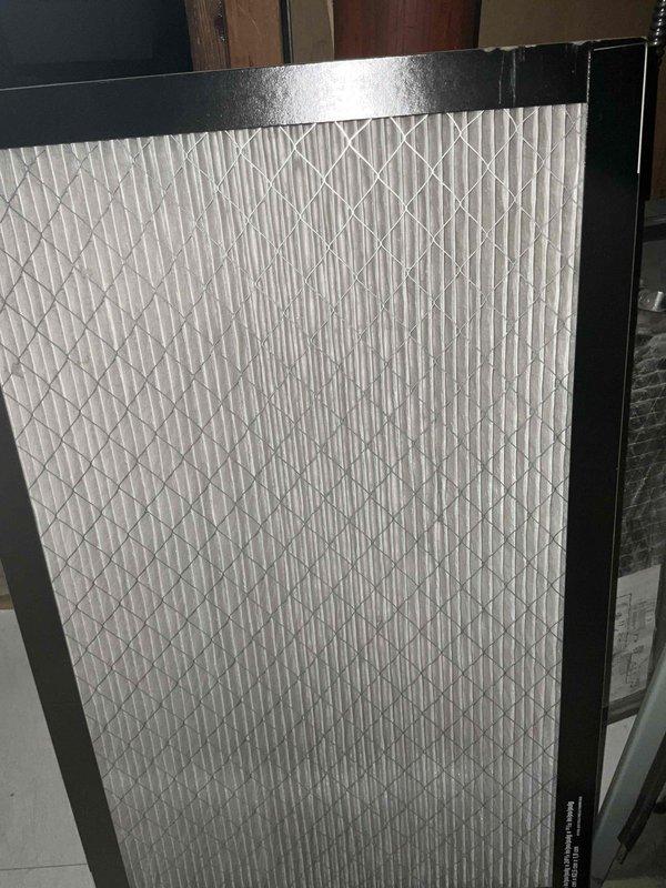 Completed comprehensive BFMA tune-up on 10+ year old air conditioning system. Thoroughly cleaned heavily soiled outdoor condenser coil which had significant dirt and debris accumulation throughout the cylindrical fin surfaces, restored proper airflow and heat transfer efficiency. Inspected indoor air filter showing clean condition with intact pleated media and frame, verified all system components operating within manufacturer specifications.