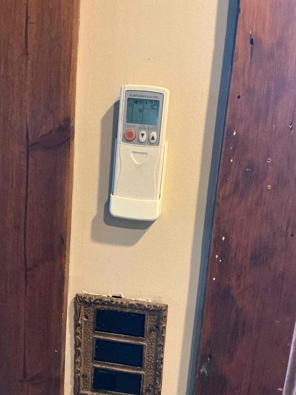 Completed comprehensive BFMA tune-up on 9+ year old residential air conditioning system. Performed full system inspection including removal of exterior panel to access internal components, verified proper operation of compressor, inspected refrigerant lines and electrical connections, examined circuit boards and wiring harness for signs of wear or damage, and confirmed wall-mounted thermostat control functionality. All components found operating within normal parameters with no immediate repairs required at time of service.