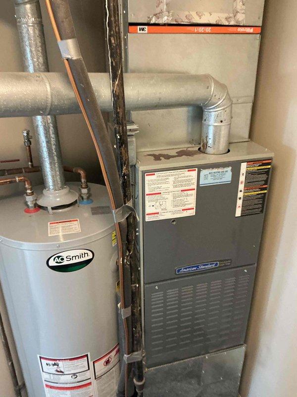 Completed comprehensive BFMA preventive maintenance tune-up on residential split system air conditioning unit with American Standard furnace and outdoor condensing unit. Performed full system inspection of indoor air handler and outdoor condenser, checked all electrical connections and components including capacitor and control board, verified proper refrigerant levels, cleaned condenser coil, inspected ductwork and drainage systems, tested system operation and confirmed all safety controls functioning properly. Unit operating within manufacturer specifications with no deficiencies noted at time of service.