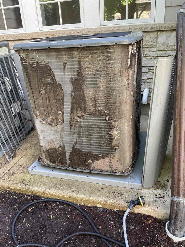 Completed comprehensive BFMA tune-up service on dual HVAC systems, both approximately 4 years old. Performed AC maintenance on two outdoor condensing units, noting significant exterior panel deterioration and biological growth requiring cleaning attention on one unit. Serviced three humidifiers including replacement of #35 pad and #80 canister components per recurring maintenance schedule. Replaced two heavily soiled pleated air filters (#213) located in basement mechanical area, which showed substantial dust accumulation. Inspected ductwork connections, refrigerant lines, and system components for proper operation. All units tested and operating within normal parameters following maintenance procedures.