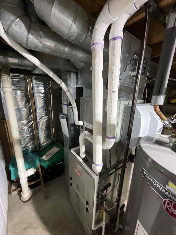 Completed comprehensive BFMA tune-up on residential HVAC system with equipment age 5+ years during morning service window. Performed full air conditioning system inspection and maintenance including filter evaluation, refrigerant level check, electrical component testing, condenser coil cleaning, and thermostat calibration. Inspected furnace unit and associated ductwork, verified proper airflow, examined PVC condensate drain lines for blockages, and confirmed all mechanical components operating within manufacturer specifications.