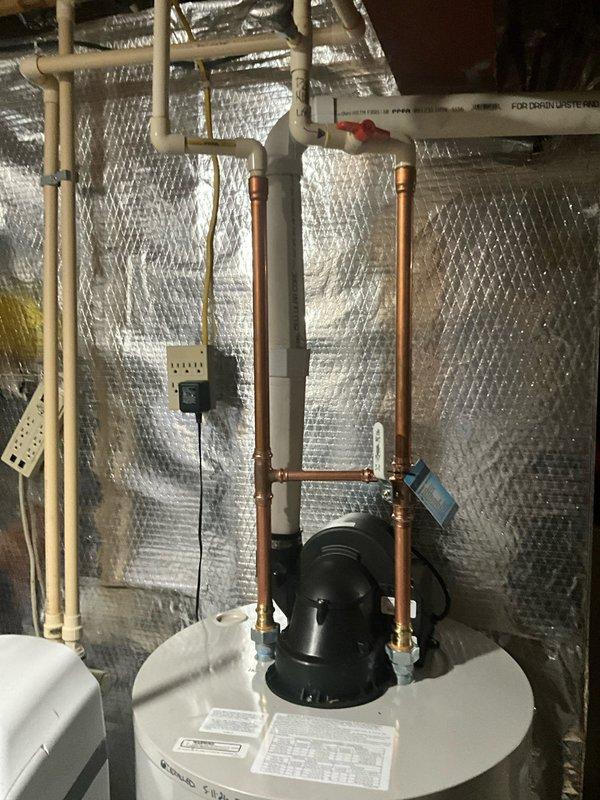 Shut off water supply to home and drained entire plumbing system. Removed and disposed of existing water heater from basement location. Installed new 50-gallon Bradford White gas power vent water heater with 6-year tank warranty, 6-year manufacturer parts warranty, and 1-year labor warranty. Modified and connected all gas lines, water lines, and power vent flue system to ensure code-compliant installation. Replaced failing CPVC ball valve on cold water inlet line with new copper ball valve on existing copper piping as a courtesy upgrade for improved reliability and longevity.