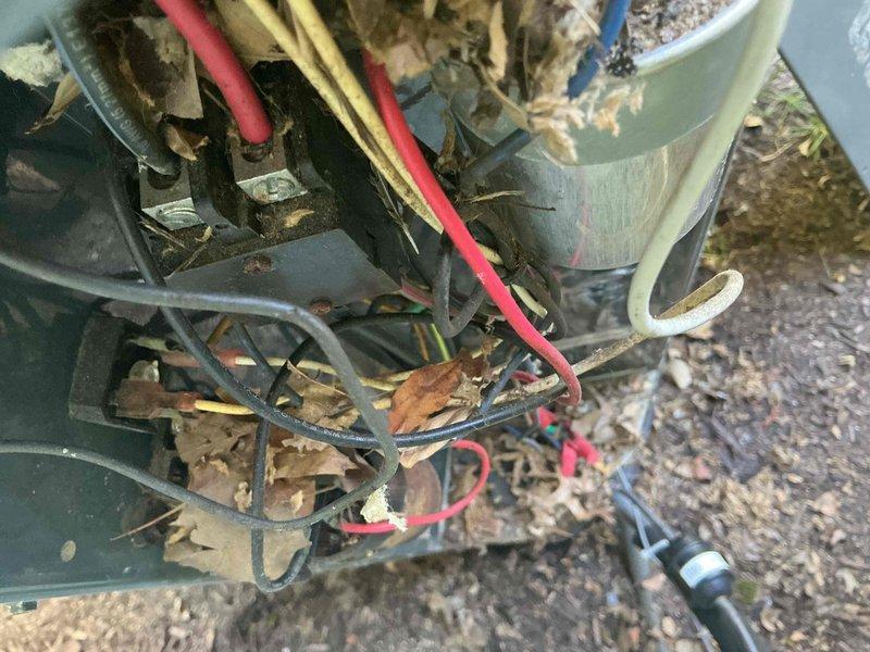 Completed comprehensive AC tune-up on 9+ year old unit, arriving after 11am per customer preference. Removed significant accumulation of dried leaves and debris from outdoor condenser unit, cleaned internal components, and inspected electrical connections including capacitor, wiring harness, and associated hardware. All systems tested and operating within normal parameters following maintenance service.