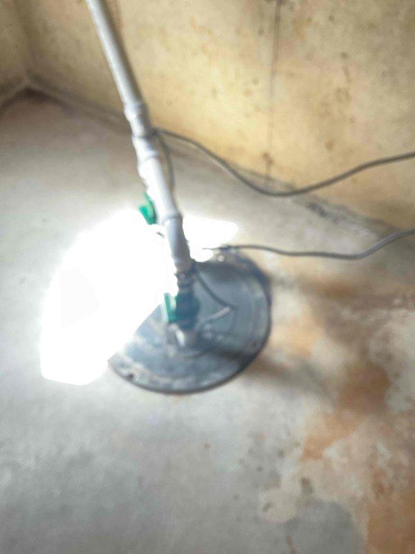 Completed comprehensive air conditioning tune-up and system inspection. Evaluated air filtration system and confirmed proper filter installation in the HVAC return air housing. Documented existing sump pump drainage system in utility area for reference. All components inspected and system operating within normal parameters.
