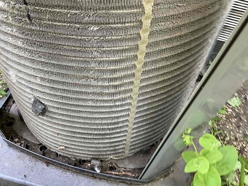 Completed comprehensive BFMA seasonal tune-up on residential air conditioning system. Performed full system inspection including condenser unit evaluation, refrigerant line assessment, and electrical connection verification. Condenser coils showed moderate dust and debris accumulation between fins, which is typical for outdoor units; coils remain structurally sound with no bent fins or damage. Inspected compressor assembly, mounting hardware, and copper refrigerant lines with insulation intact. All mechanical components, wiring connections, and mounting brackets verified secure and operational. System operating within normal parameters with no deficiencies noted.