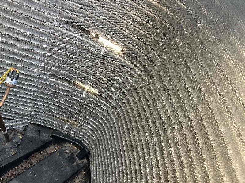 Completed comprehensive BFMA tune-up on residential air conditioning system. Performed thorough inspection of evaporator coil assembly, identifying significant dust and debris accumulation on fin surfaces that was restricting airflow and reducing heat transfer efficiency. Cleaned coil fins, inspected refrigerant lines and electrical connections, and verified proper system operation upon completion.