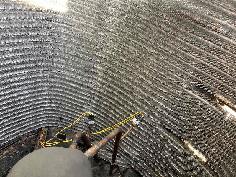 Completed comprehensive BFMA tune-up on residential air conditioning system. Performed thorough inspection of evaporator coil assembly, identifying significant dust and debris accumulation on fin surfaces that was restricting airflow and reducing heat transfer efficiency. Cleaned coil fins, inspected refrigerant lines and electrical connections, and verified proper system operation upon completion.