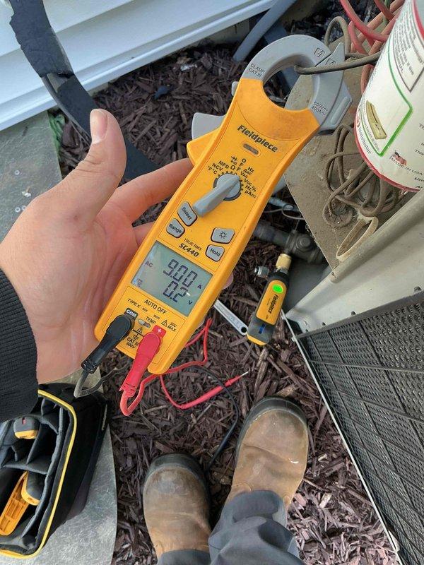 Completed comprehensive BFMA tune-up on 18-year-old Lennox air conditioning system. Performed electrical diagnostics using clamp meter to verify proper amperage draw and system operation. Inspected outdoor condenser unit, confirmed proper airflow through coil, checked refrigerant lines, and verified unit is operating within normal parameters for continued reliable cooling performance.