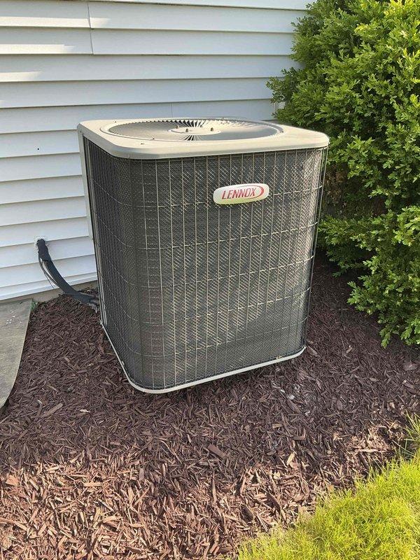 Completed comprehensive BFMA tune-up on 18-year-old Lennox air conditioning system. Performed electrical diagnostics using clamp meter to verify proper amperage draw and system operation. Inspected outdoor condenser unit, confirmed proper airflow through coil, checked refrigerant lines, and verified unit is operating within normal parameters for continued reliable cooling performance.