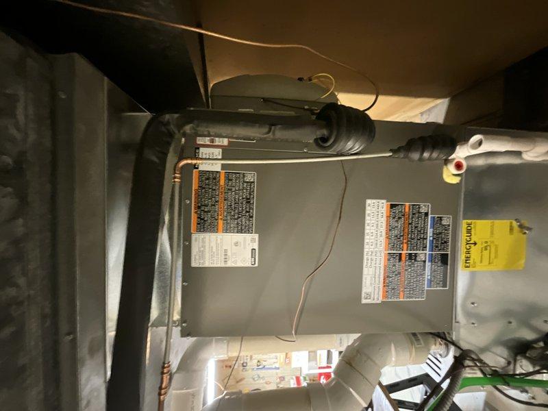 Completed full Lennox AC system replacement including installation of EL15LC1-042 condenser unit and CK40CT-048C evaporator coil. Installed new Honeywell thermostat and critter guard kit to protect outdoor unit from pest intrusion. Air handler mounted in attic space with proper refrigerant line connections, electrical hookup, and condensate drainage configured per manufacturer specifications. System tested and verified operational with proper airflow and temperature differential across coil. All equipment labels and documentation attached to units for future reference.