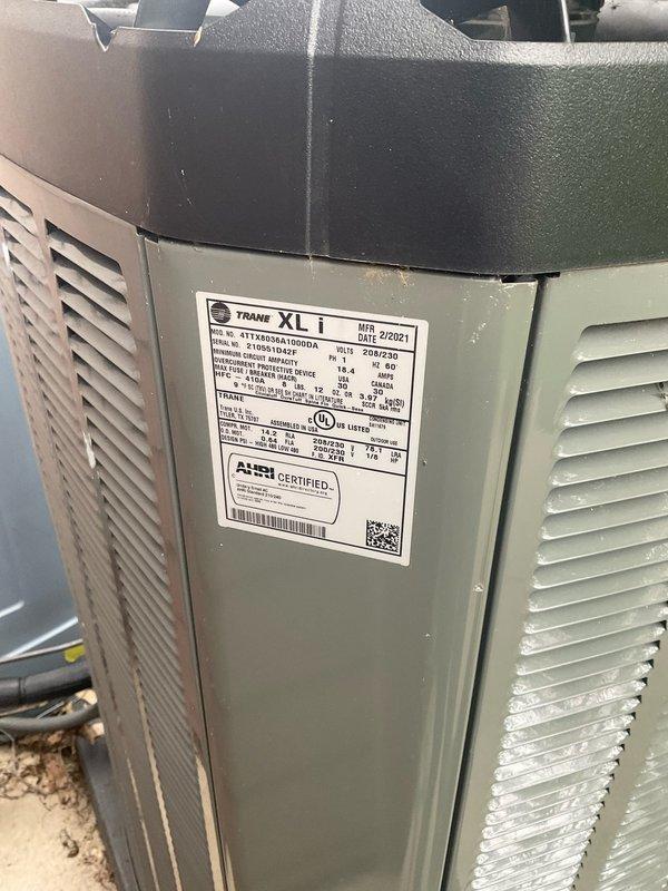 Completed BFMA tune-up on 7-year-old Trane XLi air conditioning system (MFR. 2/2021, Serial #2105S31043F). Performed comprehensive maintenance inspection including visual assessment of outdoor condenser unit, coil condition evaluation, and refrigerant line inspection. Unit found operating with significant ice buildup on condenser coil surfaces, indicating potential airflow restriction, refrigerant charge issues, or system operational concerns requiring further diagnostics and corrective action.