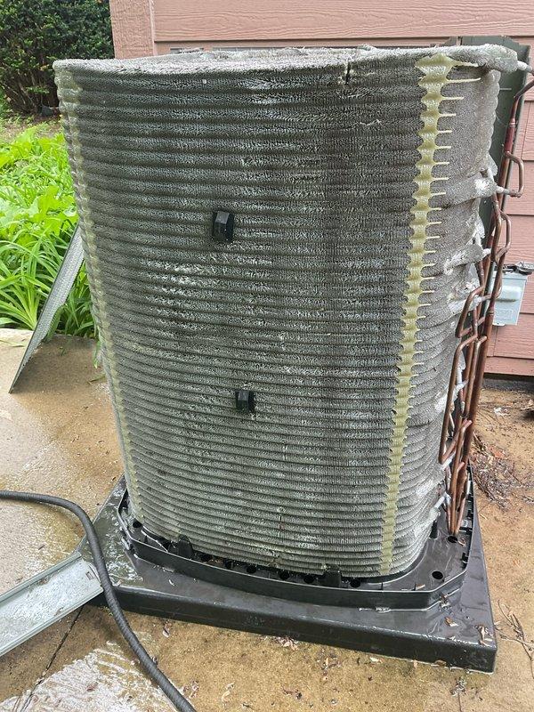 Completed BFMA tune-up on 7-year-old Trane XLi air conditioning system (MFR. 2/2021, Serial #2105S31043F). Performed comprehensive maintenance inspection including visual assessment of outdoor condenser unit, coil condition evaluation, and refrigerant line inspection. Unit found operating with significant ice buildup on condenser coil surfaces, indicating potential airflow restriction, refrigerant charge issues, or system operational concerns requiring further diagnostics and corrective action.