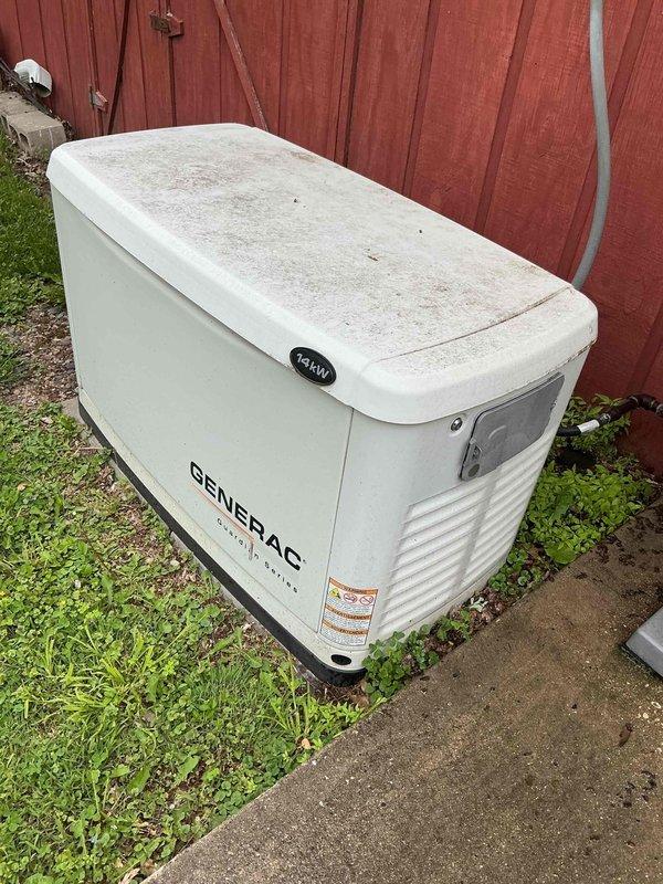 Completed comprehensive air conditioning tune-up service including inspection of blower assembly, which showed normal dust accumulation on fan blades and housing. Verified system operation and documented equipment condition, including exterior Generac backup generator unit located on property pad.