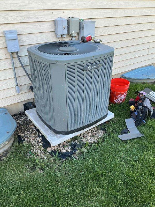 Completed comprehensive BFMA tune-up on 17+ year old Trane outdoor condensing unit. Performed full system inspection, tested electrical connections at disconnect box, verified proper operation of compressor and condenser fan motor, cleaned condenser coils, checked refrigerant levels, and ensured all safety controls were functioning correctly. Unit operating within manufacturer specifications upon completion.