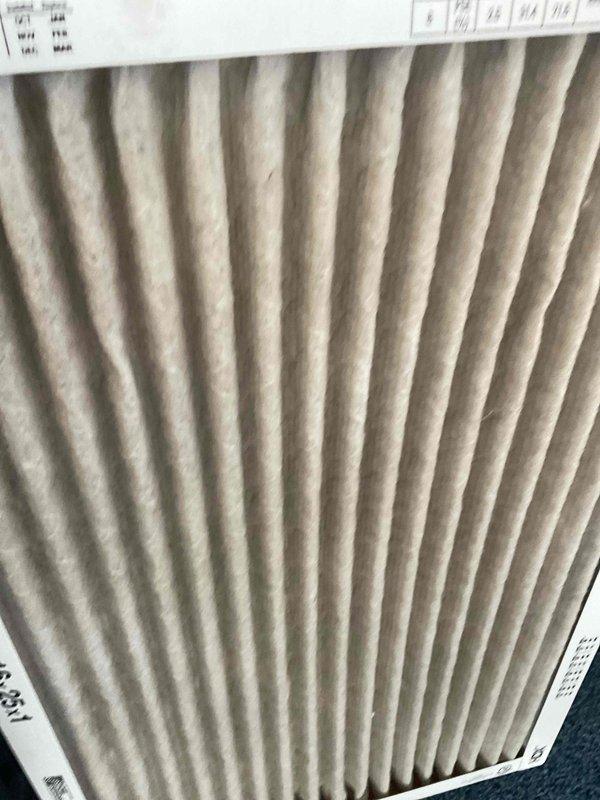 Completed comprehensive tune-up service on two air conditioning systems, both approximately 24 years old. Performed standard maintenance procedures including inspection of all major components, checking refrigerant levels, testing electrical connections, and evaluating overall system performance. Documented existing air filter conditions showing moderate dust accumulation with visible particulate matter embedded in pleated filter media; filters remain functional but show normal wear from extended service. All systems operational upon completion of maintenance.