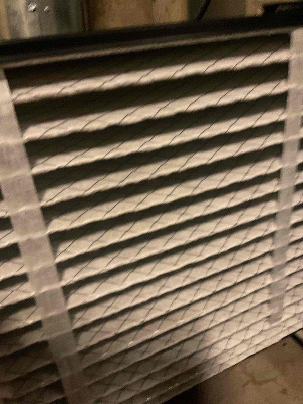 Completed comprehensive tune-up service on two air conditioning systems, both approximately 24 years old. Performed standard maintenance procedures including inspection of all major components, checking refrigerant levels, testing electrical connections, and evaluating overall system performance. Documented existing air filter conditions showing moderate dust accumulation with visible particulate matter embedded in pleated filter media; filters remain functional but show normal wear from extended service. All systems operational upon completion of maintenance.