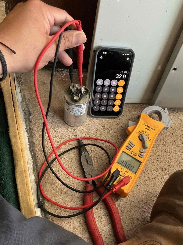 Completed comprehensive BFMA tune-up service on 13-year-old residential HVAC system during scheduled morning appointment. Performed thorough inspection of furnace unit, tested and verified capacitor functionality using digital multimeter with readings of 32.9 microfarads, and conducted amperage draw testing with clamp meter showing 20.00 amps to ensure system operating within manufacturer specifications. All components found to be functioning properly with no deficiencies noted at time of service.