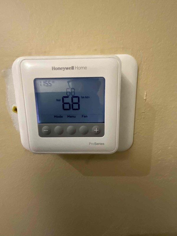 Completed comprehensive BFMA tune-up service on residential air conditioning system over 6 years old. Performed standard maintenance protocol including system inspection, verified proper thermostat operation with Honeywell Home ProSeries unit displaying 68°F setpoint, and installed clean Bryant air filter with cardboard frame. All components operating within normal parameters upon completion of service.