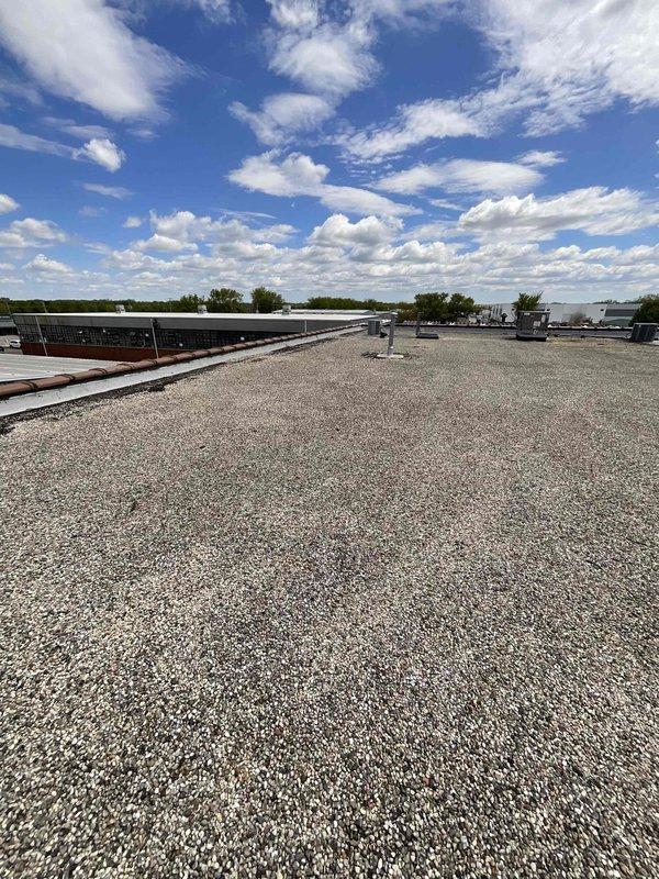 Performed comprehensive inspection and service on multiple commercial rooftop units at client facility. Documented equipment specifications, model numbers, and operational parameters for 7-8 RTU systems across the building's gravel-surfaced roof. All units assessed for performance and maintenance requirements.