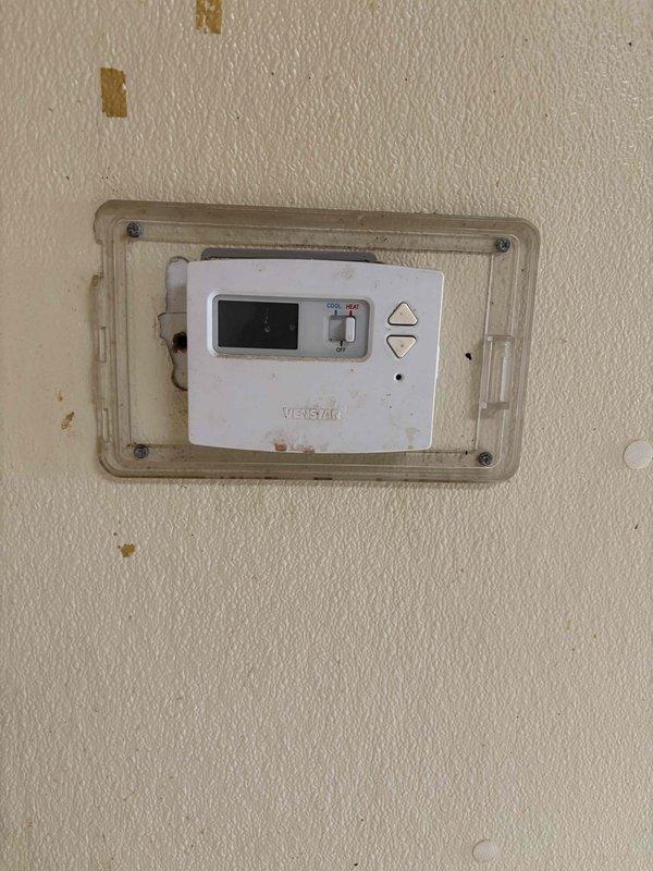 Completed commercial RTU tune-up on Unit 101 at vacant building (former pizza restaurant). Performed standard preventive maintenance procedures including inspection of thermostat operation, motor assembly, and blower components. Documented existing equipment condition showing age-related wear on motor housing and internal components with visible corrosion on coils and pulley assembly.