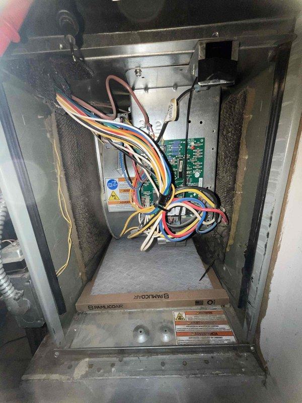 Completed comprehensive BFMA tune-up service on Bard/LicoAire HVAC air handler unit. Performed full system inspection, accessing internal components through main cabinet panel to evaluate control boards, wiring connections, and overall equipment condition. Noted significant dust and debris accumulation within blower assembly and cylindrical housing chamber, indicating extended service interval. Documented equipment age and model information for maintenance records. All electrical connections, circuit boards, and wiring harnesses inspected and found secure with no immediate concerns noted on dual green control boards.