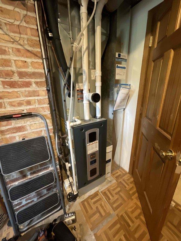 Completed comprehensive BFMA tune-up on residential air conditioning system over 5 years old. Performed standard maintenance protocol including inspection of air handler unit, verification of proper airflow, filter assessment, and system diagnostics. Equipment located in utility room with furnace and plumbing systems; all components found operating within normal parameters and unit left in proper working condition.