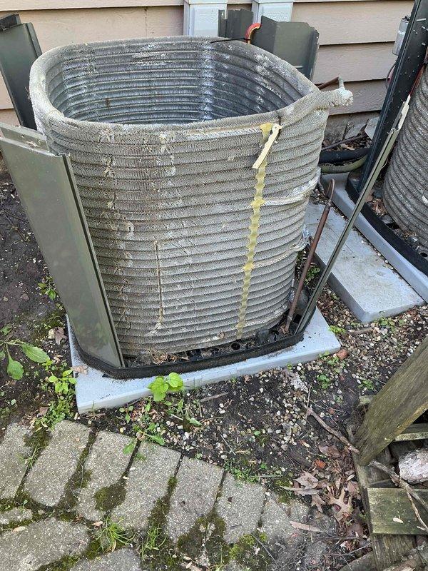 Completed comprehensive BFMA tune-up service on two air conditioning systems with equipment aged 7-20+ years. Performed standard maintenance procedures including inspection of outdoor condenser units, which showed significant dirt and debris accumulation on coil fins requiring cleaning. Replaced heavily soiled air filters on both systems to restore proper airflow and system efficiency.