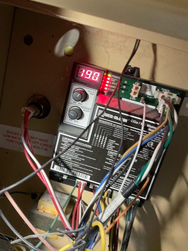 Completed comprehensive BFMA tune-up service on 8+ year old heating and cooling system, including full AC maintenance and boiler inspection. Accessed boiler control compartment, verified proper operation of electronic control module displaying normal parameters, inspected all electrical connections and wiring harness for secure terminations. Cycled boiler through operational sequence to verify ignition, flame sensing, and temperature controls functioning correctly per manufacturer specifications, checked expansion tank pressure, inspected all copper piping connections for leaks, and confirmed proper venting system integrity.