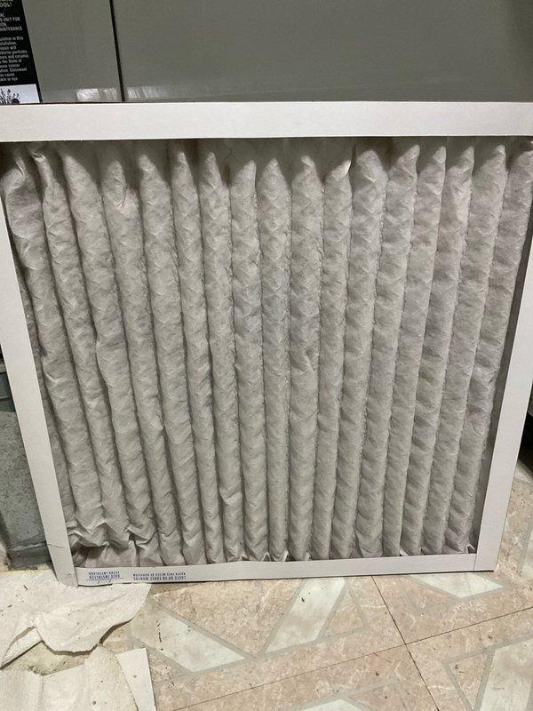 Completed comprehensive BFMA air conditioning tune-up on 9-year-old system. Inspected evaporator coil and identified significant dust and debris accumulation on lower coil section, affecting heat transfer efficiency. Replaced dirty air filter with new unit to restore proper airflow and system performance.