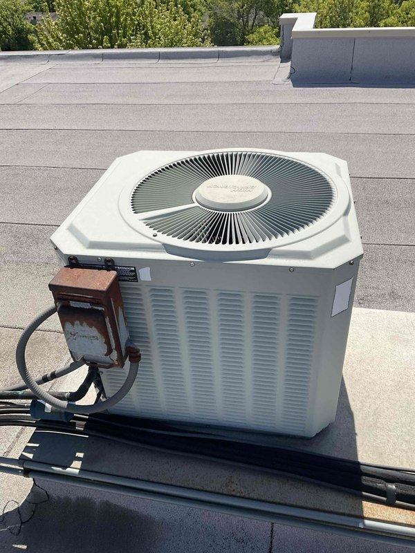 Completed comprehensive BFMA tune-up on 23-year-old rooftop air conditioning system. Upon inspection, evaporator coil exhibited heavy accumulation of dirt and debris significantly restricting airflow and reducing system efficiency. Performed thorough cleaning of evaporator coil, removing caked-on contamination from fins to restore proper air circulation. Inspected condenser unit exterior condition, verified electrical disconnect box connections, and confirmed unit mounted securely on vibration-dampening pad. System operational following maintenance service.