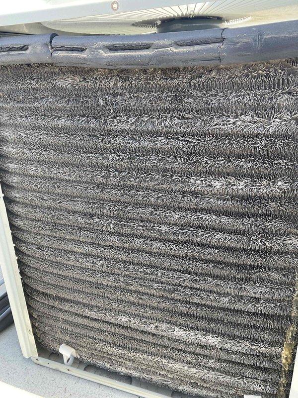 Completed comprehensive BFMA tune-up on 23-year-old rooftop air conditioning system. Upon inspection, evaporator coil exhibited heavy accumulation of dirt and debris significantly restricting airflow and reducing system efficiency. Performed thorough cleaning of evaporator coil, removing caked-on contamination from fins to restore proper air circulation. Inspected condenser unit exterior condition, verified electrical disconnect box connections, and confirmed unit mounted securely on vibration-dampening pad. System operational following maintenance service.