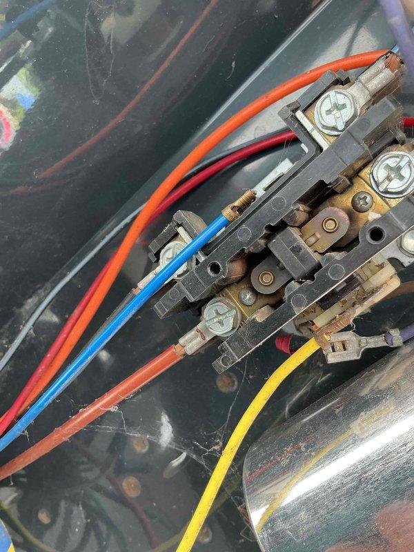 Completed comprehensive BFMA tune-up on 18+ year old outdoor air conditioning condenser unit. Performed standard maintenance protocol including inspection of electrical connections at terminal block, verification of proper wire terminations across all color-coded conductors, assessment of condenser fan operation and grille condition, and evaluation of unit's overall mechanical condition. All electrical connections found secure, condenser coil airflow verified through louvers, and system operational parameters confirmed within acceptable range for equipment age.