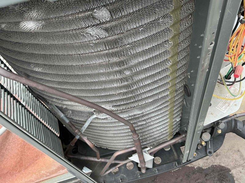 Completed comprehensive BFMA tune-up service on 3-year-old HVAC system, including full AC maintenance per CMC standards. Inspected evaporator coil assembly, refrigerant lines, and heat exchange components; noted moderate dust accumulation on coil fins and normal oxidation on copper refrigerant lines consistent with system age. All components found operational with no immediate repairs required; system performing within manufacturer specifications.