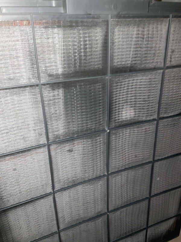 Completed comprehensive BFMA tune-up on residential air conditioning system aged 4+ years. Performed standard maintenance procedures including inspection of outdoor condenser unit, which showed moderate accumulation of debris and dirt on coils and top surface requiring cleaning attention. Evaluated indoor air filtration system with multiple pleated filters in air handling unit, confirming proper installation and assessing filter condition for optimal airflow and system efficiency.