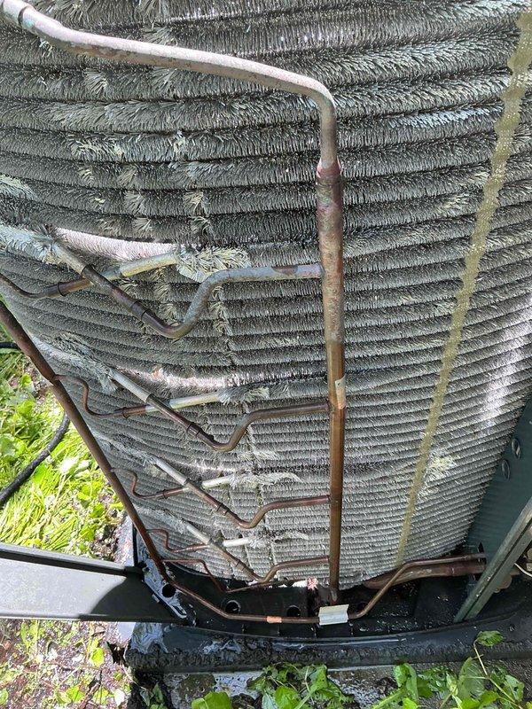 Completed comprehensive BFMA tune-up on 5-year-old air conditioning system, including full system inspection, performance testing, and preventive maintenance procedures. Inspected outdoor condensing unit with cylindrical configuration, noting accumulated environmental debris on heat exchanger coils and fins; cleaned and serviced unit to restore optimal airflow and heat transfer efficiency. Performed semi-annual filter change, verified refrigerant line connections showing normal oxidation for equipment age, inspected electrical cabinet and connections, tested system operation, and confirmed all components functioning within manufacturer specifications.