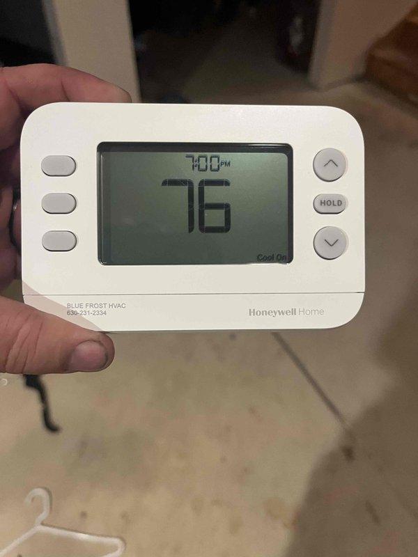 Responded to after hours call for HVAC system not cooling properly. Upon arrival, found Honeywell Home thermostat displaying 76°F and calling for cooling. Inspected electrical control panel and verified proper operation of circuit boards, terminal connections, and control wiring. All wire terminations at terminal strip were secure with proper wire management and labeling in place. System tested and confirmed operational with cooling cycle engaging as programmed.