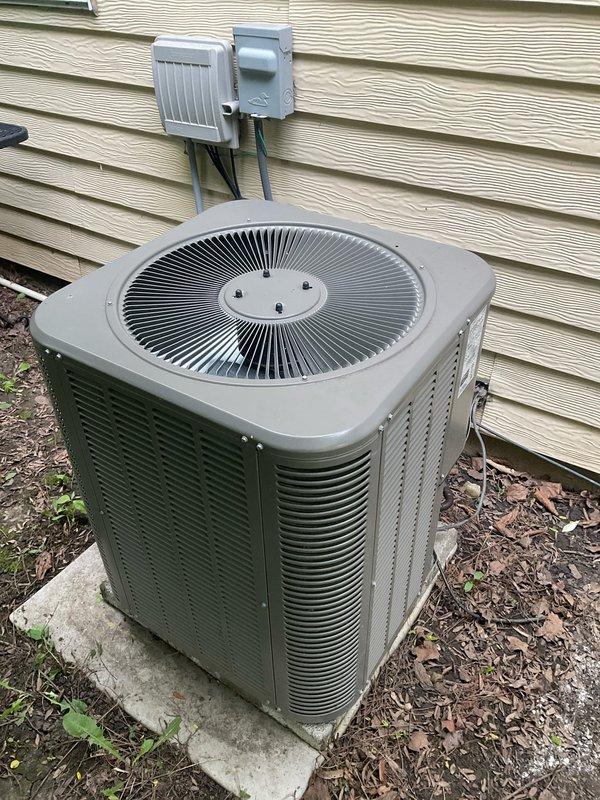 Completed comprehensive air conditioning tune-up on an 8+ year old system, including inspection of outdoor condenser unit, electrical disconnect, and all mechanical components. Addressed customer concern regarding furnace making loud noise resembling a ball bearing issue during operation. Inspected air filtration system and identified lower filter exhibiting significant deformation and wrinkling, likely due to moisture exposure or airflow restriction, which was contributing to system strain. Replaced damaged filter, verified proper airflow through both filter stages, and confirmed outdoor unit operation with fan assembly functioning normally. Checked electrical connections at disconnect box and condenser unit for secure contact and proper voltage. Performed standard tune-up procedures including cleaning condenser coils, inspecting refrigerant lines, and verifying system cycling. All components operating within normal parameters following service completion.