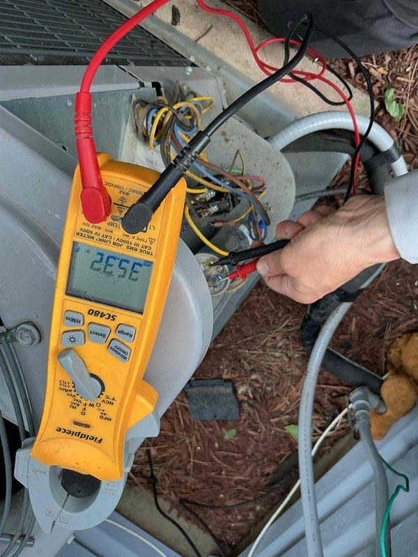 Completed comprehensive BFMA tune-up on 1-year-old residential heat pump system. Performed electrical diagnostics using digital multimeter, verified capacitor functionality and all electrical connections, tested system operation and temperature readings which showed 352°F discharge temperature. All components inspected and found operating within normal parameters; system running efficiently with no deficiencies noted.