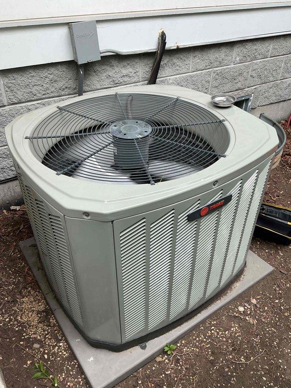 Completed comprehensive air conditioning tune-up on 12+ year old Trane condensing unit. Performed full system inspection including electrical testing with amp draw readings, verified proper voltage at disconnect, cleaned condenser coils, checked refrigerant levels, and ensured all components operating within manufacturer specifications. Unit running efficiently with no immediate concerns identified at time of service.