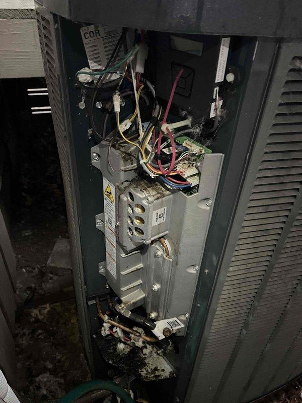 Responded to no cooling call with clicking noise reported at indoor unit. Upon inspection, found outdoor XV20 unit with debris accumulation on top and indoor air handler with visible moisture damage and debris in lower compartment. Diagnosed failed contactor causing clicking sound without compressor engagement. Replaced defective contactor, cleaned debris from outdoor unit coil and top surface, and verified all electrical connections. Cycled system through complete cooling operation, confirmed proper compressor startup, normal amperage draw, and adequate airflow. System restored to full cooling capacity with no abnormal sounds.