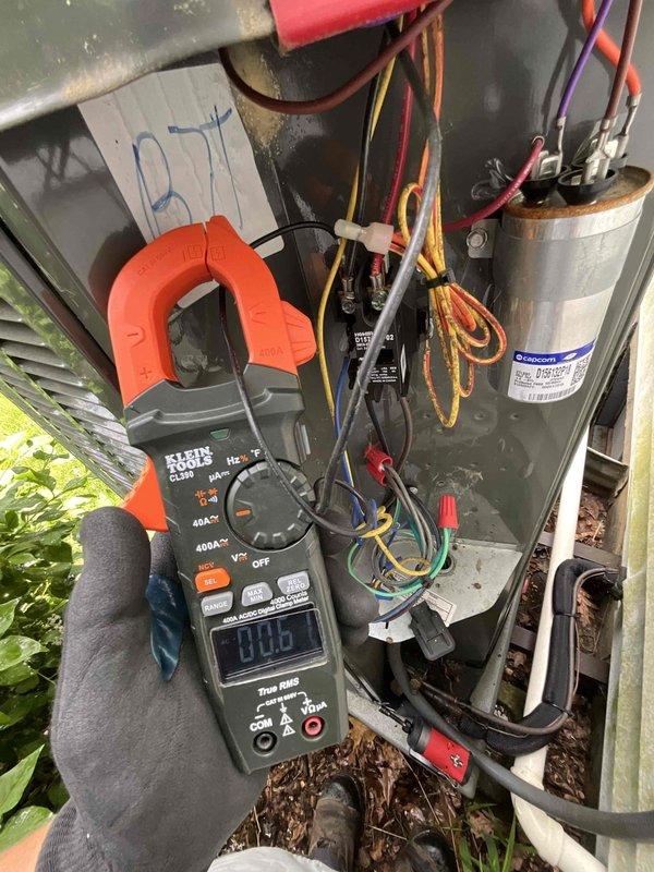 Completed comprehensive AC tune-up on outdoor condensing unit over 3 years old. Performed electrical diagnostics using clamp meter to verify system amperage and voltage readings, inspected capacitor condition and all electrical connections, and evaluated overall system performance. All components found operating within normal parameters with no immediate repairs required.