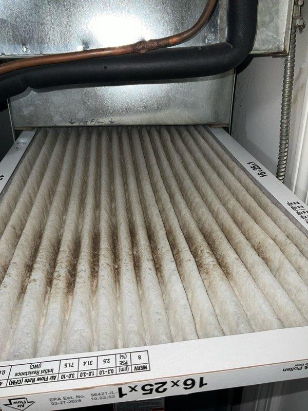 Completed comprehensive BFMA tune-up on 12-year-old residential air conditioning system. Inspected outdoor condensing unit and found significant dirt and debris accumulation on condenser coil fins; cleaned and cleared buildup to restore proper airflow and heat transfer efficiency. Inspected indoor air handler and replaced dirty 16x25x1 pleated air filter showing heavy dust accumulation to improve system airflow and indoor air quality. Performed standard preventive maintenance procedures including checking refrigerant levels, testing electrical connections, verifying proper thermostat operation, and ensuring all components functioning within manufacturer specifications. System operating normally upon completion with improved efficiency and airflow.